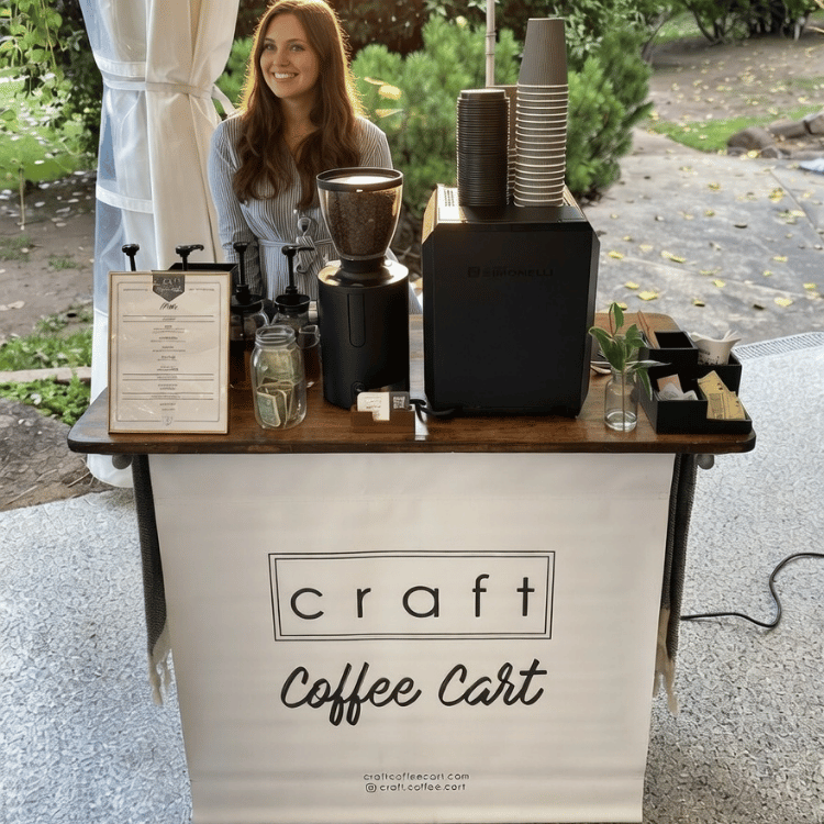 Friendly barista making coffee at wedding from Craft Coffee Cart